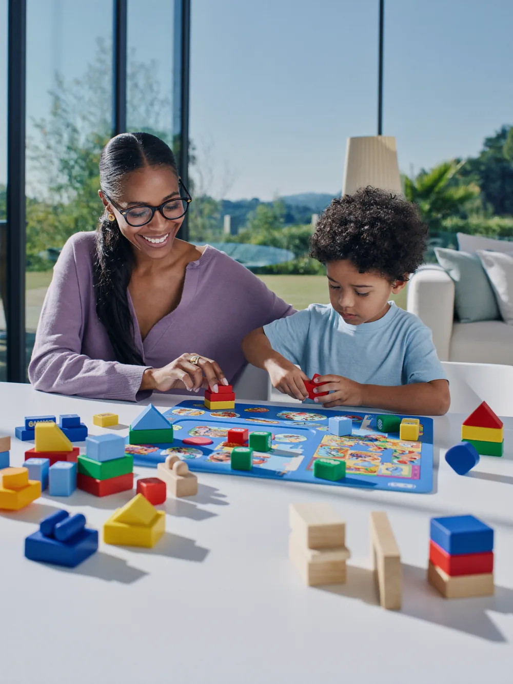 Mother and child playing with wooden educational toys